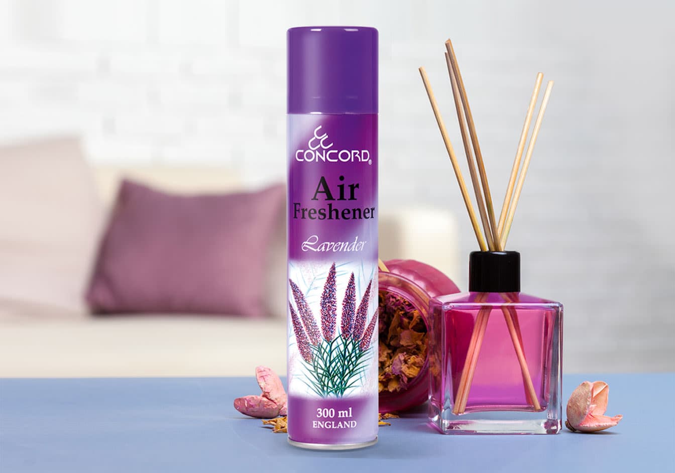 Concord Air Freshener Lavender 300 ml, shown in a living room setting alongside a reed diffuser.